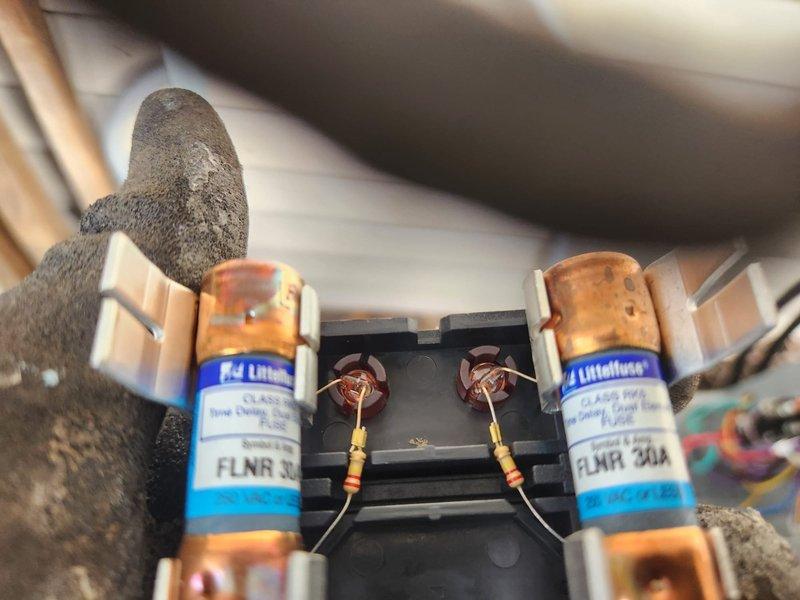 Successfully completed installation of a new Amana furnace and AC system with humidifier and chimney liner. Verified proper electrical connections with appropriate 30A Littelfuse fuses in the fuse block. System was installed with proper ductwork, exhaust venting, and drainage components according to manufacturer specifications.