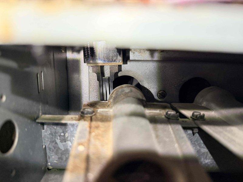 Performed routine maintenance on aging HVAC system (10+ years old). Inspected heat exchanger which showed signs of corrosion and discoloration on metal piping. Cleaned and examined blower wheel assembly, which was in normal working condition with no significant dust buildup or damage. System is operational but recommended continued annual maintenance due to equipment age.