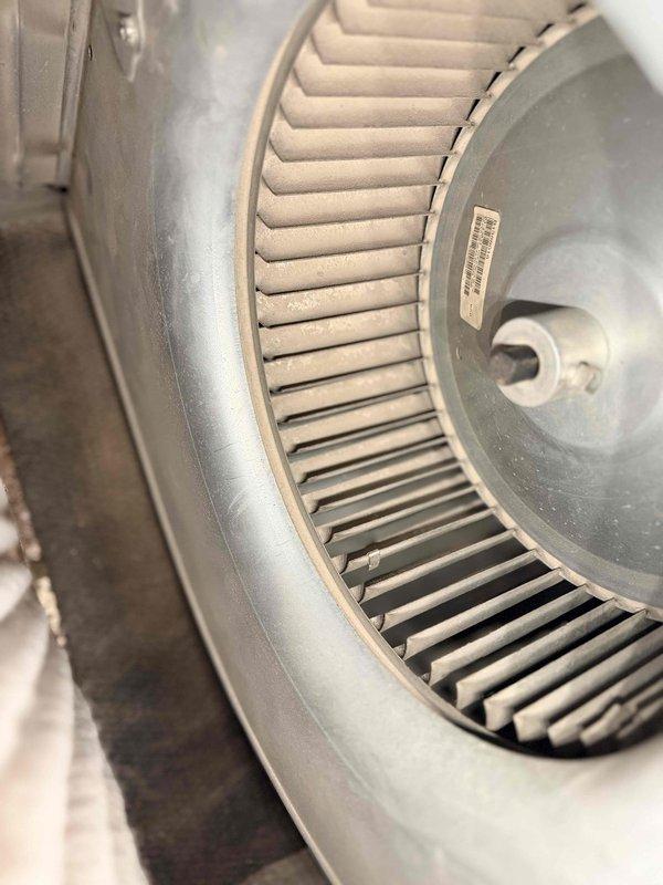 Performed routine maintenance on aging HVAC system (10+ years old). Inspected heat exchanger which showed signs of corrosion and discoloration on metal piping. Cleaned and examined blower wheel assembly, which was in normal working condition with no significant dust buildup or damage. System is operational but recommended continued annual maintenance due to equipment age.