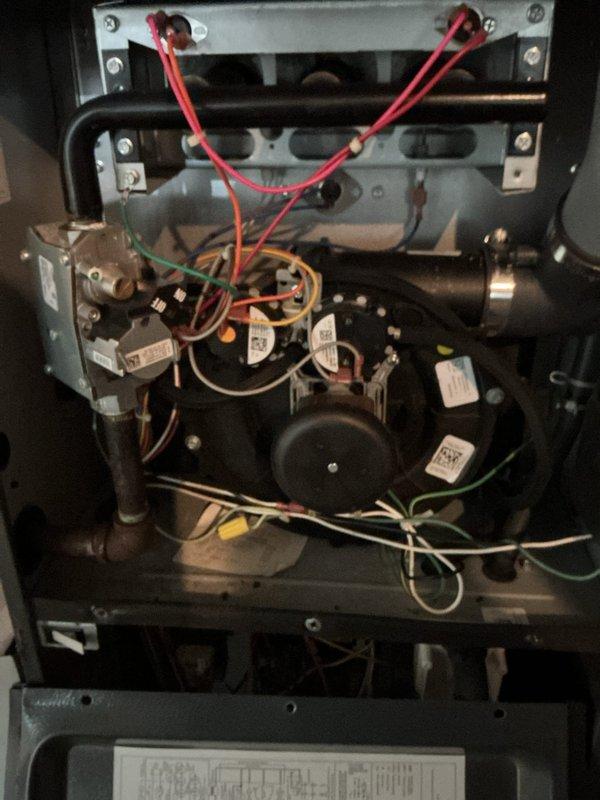 Performed scheduled heating maintenance service on furnace system. Inspected internal components including blower motor, wiring connections, and electrical assemblies. Conducted gas pressure testing with digital manometer showing 2.43" WC, confirming system is operating within manufacturer specifications.