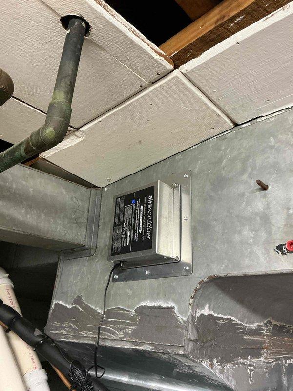 Performed routine heating maintenance on existing system; inspected electrical connections and wiring integrity within control panel. Verified proper operation of motor assembly and checked condition of metal casing which showed signs of previous repair at lower edge.