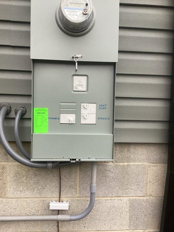 Performed startup inspection on AC system. Checked electrical connections at service panel containing HVAC controls (FURNACE and HEAT PUMP). Identified foundation wall cracks in basement area near electrical installation that may require attention. Documentation photos taken of electrical panel and affected foundation area.