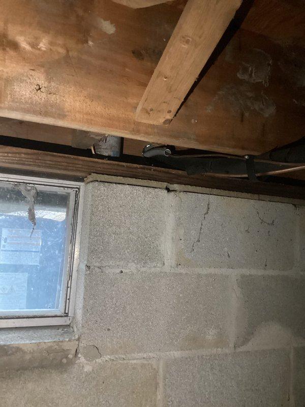 Performed startup inspection on AC system. Checked electrical connections at service panel containing HVAC controls (FURNACE and HEAT PUMP). Identified foundation wall cracks in basement area near electrical installation that may require attention. Documentation photos taken of electrical panel and affected foundation area.