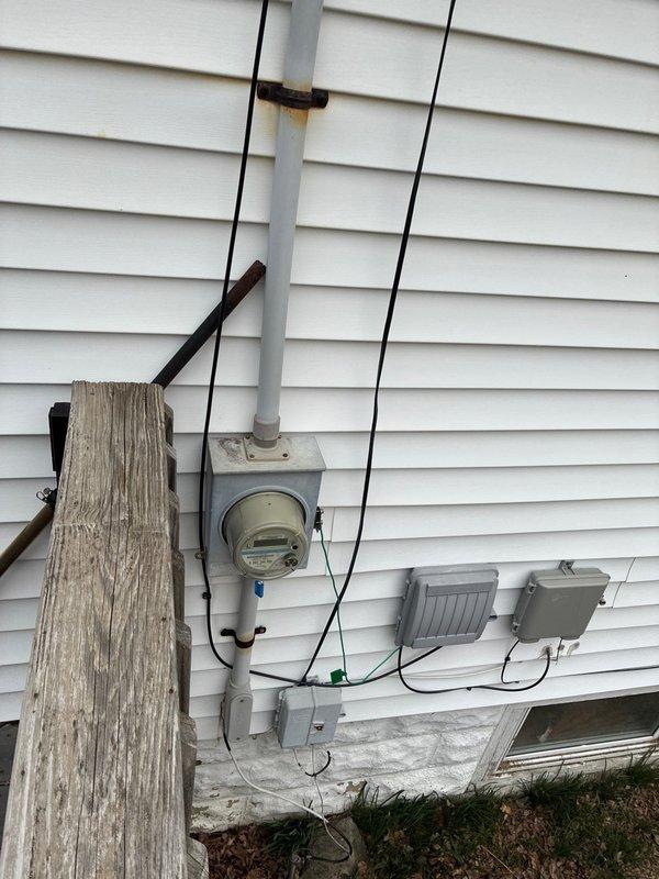 Performed comprehensive evaluation of existing HVAC system and provided customer with two separate quotations: one for furnace replacement options and another for a complete system upgrade including AC installation (add-on AC quote). Inspected electrical service entrance components and existing Honeywell thermostat (currently reading 63°F) to ensure compatibility with proposed equipment.
