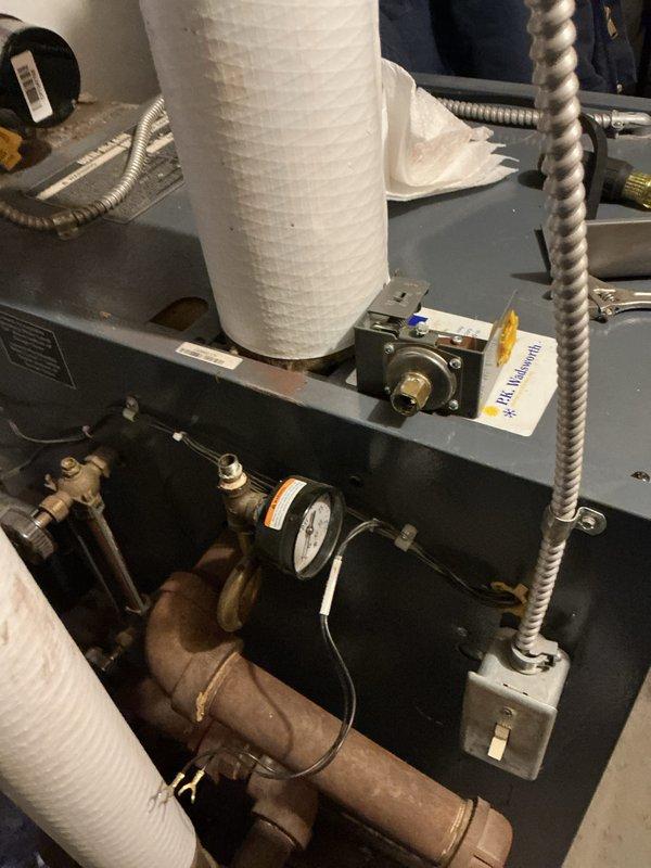 Performed routine maintenance on boiler system, inspecting pressure gauge readings and verifying proper operation of control components. Accessed furnace interior to examine electrical connections and wiring integrity, and checked copper supply lines for signs of leaks or corrosion.