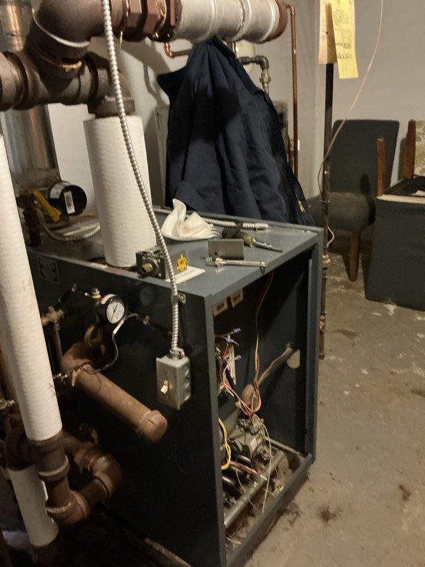 Performed routine maintenance on boiler system, inspecting pressure gauge readings and verifying proper operation of control components. Accessed furnace interior to examine electrical connections and wiring integrity, and checked copper supply lines for signs of leaks or corrosion.