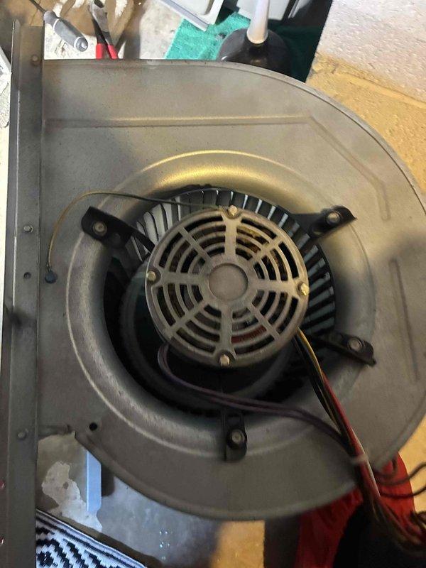 Performed thorough blower wheel cleaning and evaporator coil wash on aging HVAC system showing significant corrosion on copper components and visible oxidation throughout. Successfully cleaned blower assembly and motor housing, addressing accumulated debris that was impacting system performance and efficiency.