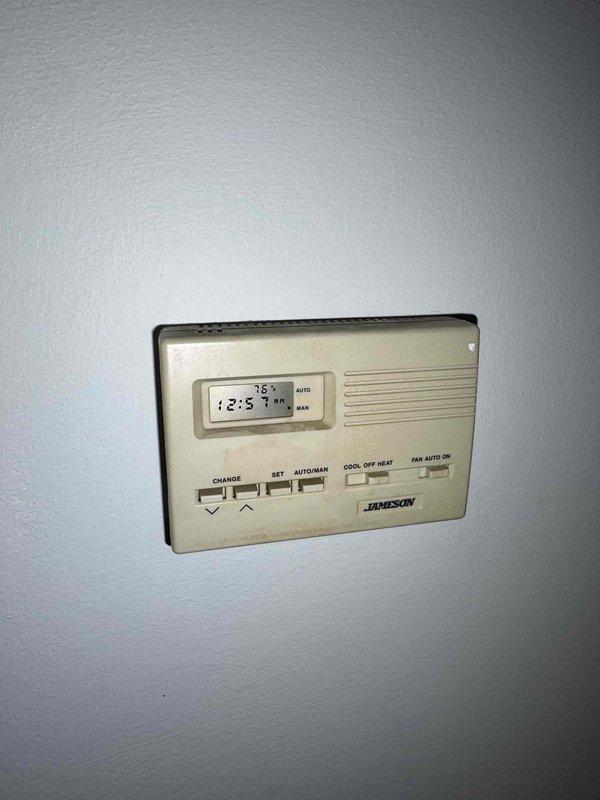 Performed scheduled boiler maintenance service including thermostat inspection and functionality verification. System was operating at proper temperature with thermostat displaying correct readings in AUTO mode. Conducted cleaning of components and checked water connections at utility sink, ensuring all parts were in working order for continued reliable heating operation.