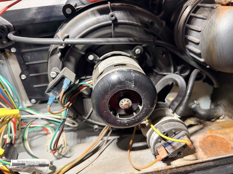 Performed scheduled heating maintenance service on furnace system. Inspected and documented condition of blower motor assembly, including motor housing, wiring connections, and mounting brackets. Visual inspection revealed normal wear with some minor oxidation on metal components, but all electrical connections were secure with proper wire routing.