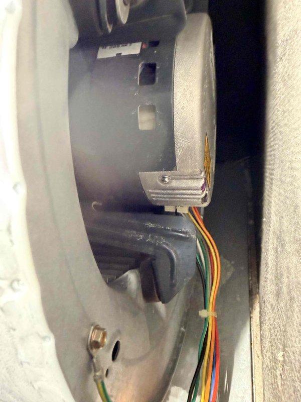 Performed scheduled heating maintenance service on furnace system. Inspected and documented condition of blower motor assembly, including motor housing, wiring connections, and mounting brackets. Visual inspection revealed normal wear with some minor oxidation on metal components, but all electrical connections were secure with proper wire routing.