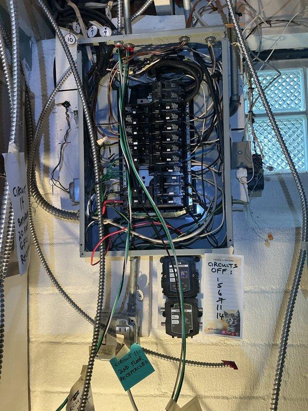 Conducted comprehensive electrical inspection of main service panel and adjacent electrical installation. Documentation included detailed photography of circuit breakers, wiring configuration, and conduit routing. Identified several circuits with handwritten tags and noted areas requiring attention as indicated by "CIRCUITS OFF!" warning.