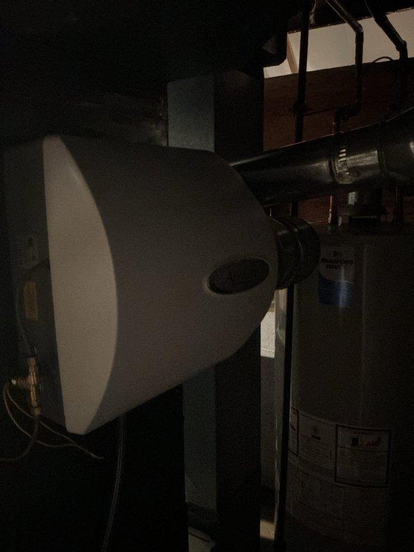 Completed scheduled heating maintenance service on gas furnace system. Performed comprehensive inspection of internal components including blower motor assembly, gas valve, burner assemblies, and control board connections. Examined whole-house humidifier mounted to ductwork and verified proper integration with HVAC system.