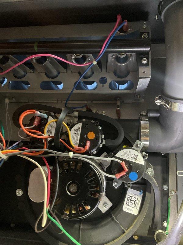 Performed scheduled maintenance on two heating systems. Inspected circuit boards and electrical components for proper operation, noting normal readings on digital display. Examined blower assembly, motor, and ventilation components - all systems functioning within normal parameters with no signs of wear or damage.