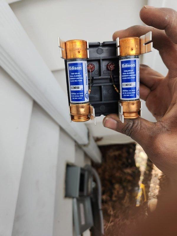 Completed installation of a Goodman 96% efficiency furnace with matching AC system. System includes properly connected ductwork with sealed plenum, PVC venting, and all required electrical components including Edison ECNR50 fuses for protection. Final inspection verified proper operation with all safety features functioning correctly.