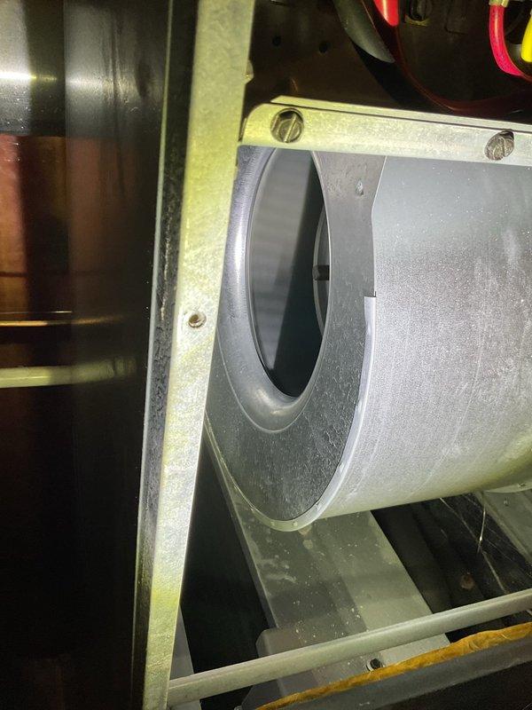 Responded to customer complaint of loud noise from furnace. Upon inspection, accessed interior components including blower assembly and control panel. Identified and serviced the blower wheel/fan assembly which showed dust accumulation, resolving the noise issue.