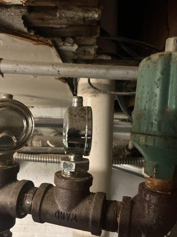Performed scheduled heating maintenance on boiler system. Inspected sight glass flow indicator on MAF valve and noted rust developing on iron piping components. Observed significant dust accumulation within equipment housing requiring cleaning; recommended regular maintenance to prevent further deterioration.