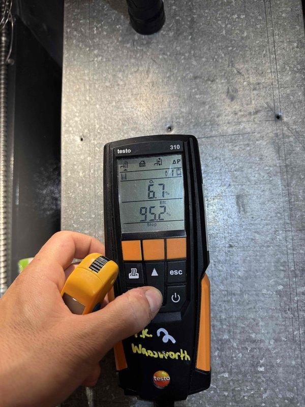 Performed scheduled heating maintenance service on furnace system. Inspected evaporator coil assembly and noted some condensation present. Conducted temperature differential testing using Testo 310 analyzer, confirming system is operating within normal parameters with readings of 67° and 95.2°.