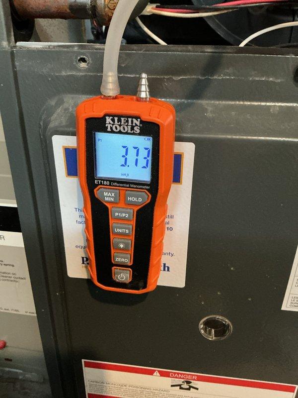 Conducted scheduled heating maintenance on furnace system. Performed combustion analysis with Klein Tools ET180 Differential Manometer, confirming gas pressure at 3.13" WC, within manufacturer specifications. Inspected water heater and surrounding mechanical area for proper clearances and ventilation in the confined utility space.