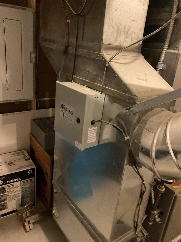 Completed routine heating maintenance service on Arzel system. Inspected ductwork connections, checked all seams and metallic tape for proper sealing, and verified proper installation of ventilation components. System appears to be in good working condition with normal wear; all wiring connections and control cables are secure and functioning properly.