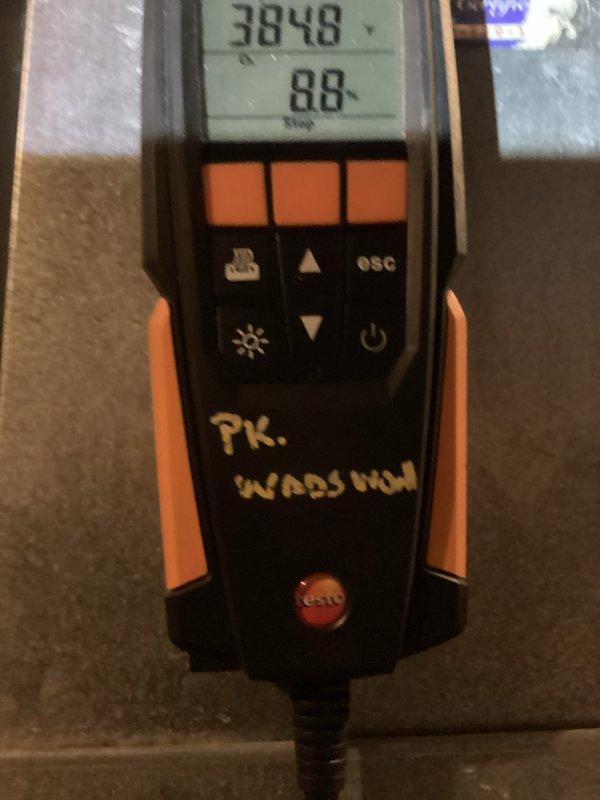 Performed routine heating system maintenance including diagnostic testing with Testo analyzer showing readings of 3848/88. Inspected and verified condition of run capacitor (7.5MFD, 370VAC) in control panel, confirming proper electrical connections to circuit board with no visible damage or leakage.