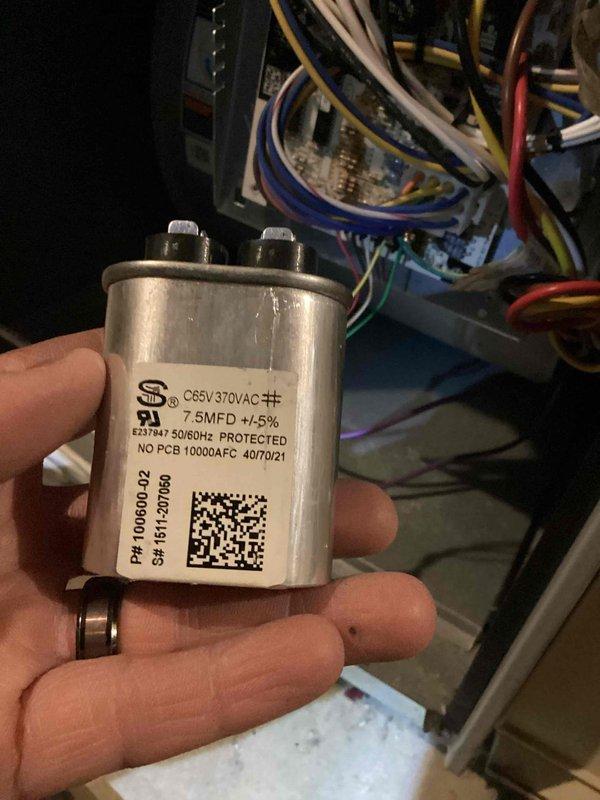 Performed routine heating system maintenance including diagnostic testing with Testo analyzer showing readings of 3848/88. Inspected and verified condition of run capacitor (7.5MFD, 370VAC) in control panel, confirming proper electrical connections to circuit board with no visible damage or leakage.