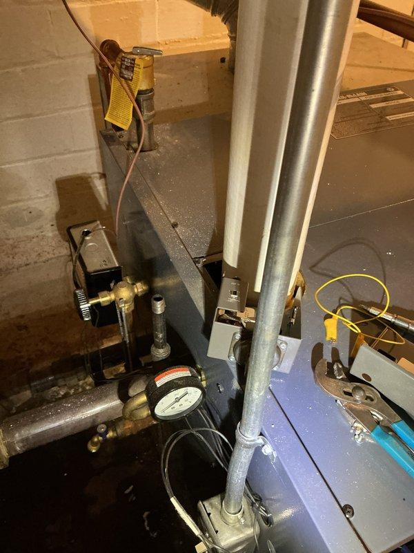 Performed scheduled maintenance on boiler system in utility room, including inspection of pressure gauge readings, valves, and pipe connections. Conducted diagnostic testing using multimeter on furnace unit and verified proper operation of all components. System was left in good working condition with all connections secure and operating parameters within normal range.