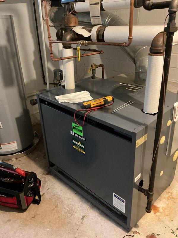 Performed scheduled maintenance on boiler system in utility room, including inspection of pressure gauge readings, valves, and pipe connections. Conducted diagnostic testing using multimeter on furnace unit and verified proper operation of all components. System was left in good working condition with all connections secure and operating parameters within normal range.