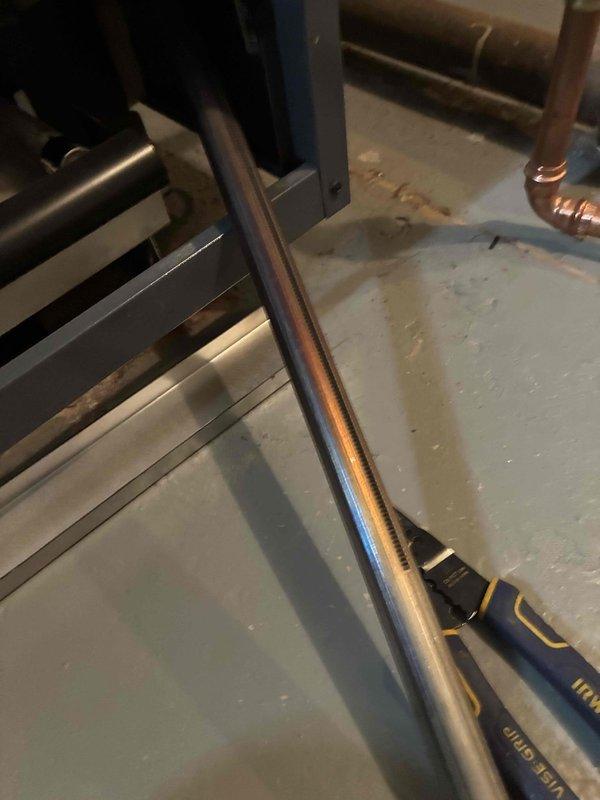 Performed routine maintenance service on boiler system, inspecting heat exchanger components showing signs of oxidation and rust formation. Examined copper piping connections and metal components of the heating system, documenting current condition with photos for maintenance records.