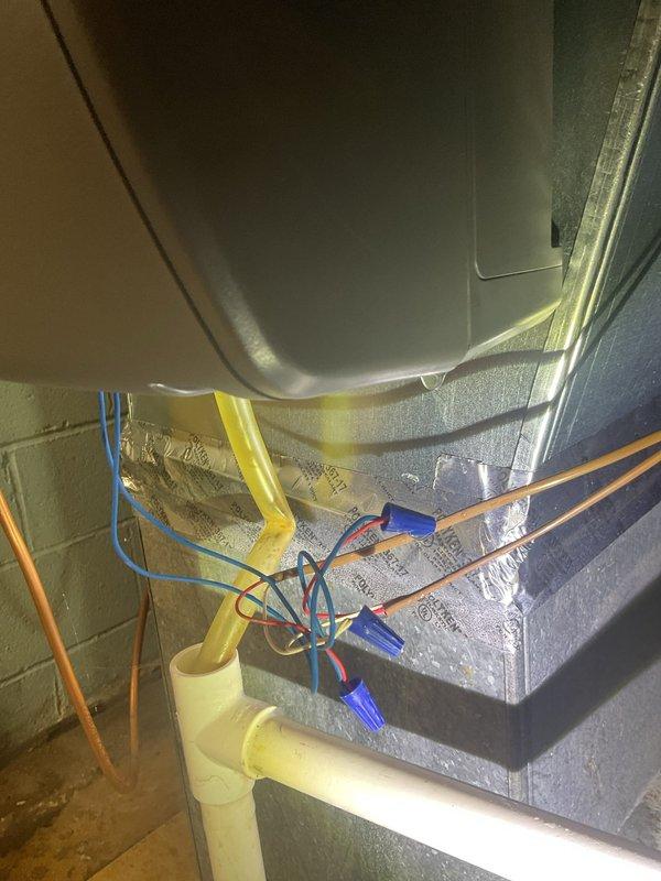 Responded to service call for furnace with water pooling around base. Inspected HVAC system including air handler, condensate drainage components, and associated PVC piping. Identified and corrected condensate drain issue causing water accumulation on utility room floor.