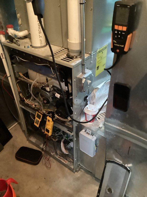 Performed scheduled heating maintenance on residential furnace system. Conducted diagnostic testing with digital measurement instrument on internal components and inspected blower wheel assembly for proper operation. System functioning normally with no issues identified.
