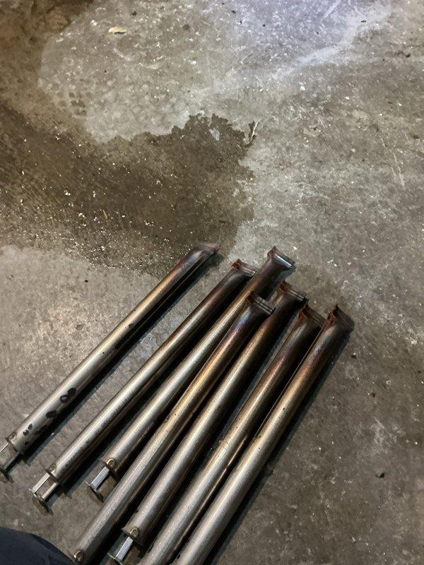 Performed scheduled maintenance on aging HVAC heating system located in basement utility area. Inspected and cleaned copper heat transfer components showing normal wear. System includes furnace unit with connected ductwork, flue piping, circulation pump assembly, and associated valves all functioning within acceptable parameters.