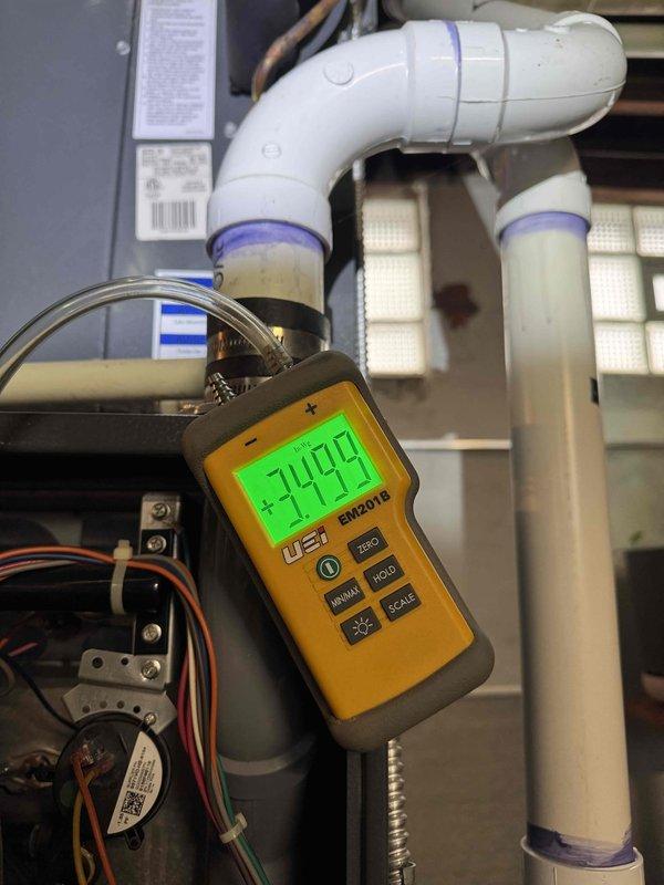 Responded to no heat complaint on system over 10 years old. Diagnostic testing revealed low gas pressure reading of +7.49" WC on the UEi EM201B meter. Inspected furnace interior components including blower motor, control board, and associated wiring harness, then made necessary pressure adjustments to restore proper heating function.