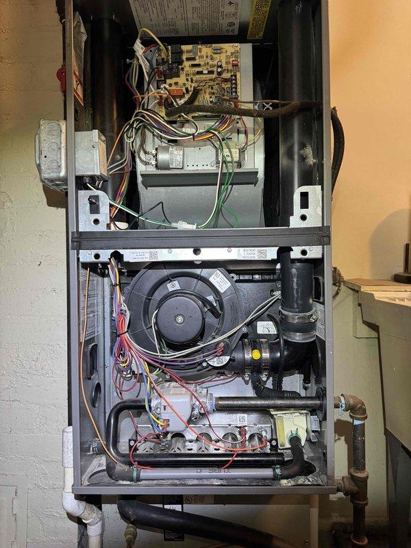 Diagnosed recurrent no-heat issue in 10-15 year old furnace that was previously serviced for flame sensor cleaning. Upon inspection of internal components, found significant dust accumulation affecting flame sensor operation and heat transfer efficiency. Thoroughly cleaned flame sensor, inspected control board connections, and performed comprehensive system cleaning to restore proper heating function.