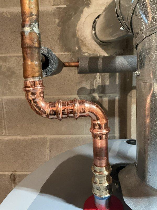 Successfully replaced an aging atmospheric gas water heater with a new 50-gallon State model. Installation included proper connection of copper supply lines with shutoff valves, PVC venting, and placement on a protective rubber mat in accordance with manufacturer specifications. All connections were pressure tested to ensure leak-free operation and proper function.