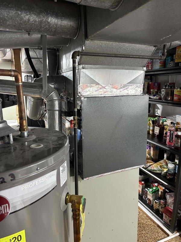 Completed installation of new A/C system in basement utility area, connecting to existing furnace unit with appropriate ductwork and PVC drainage lines. System was properly connected to electrical panel, pressure tested, and charged with refrigerant to manufacturer specifications. Final inspection confirmed proper operation with all safety features functioning correctly.