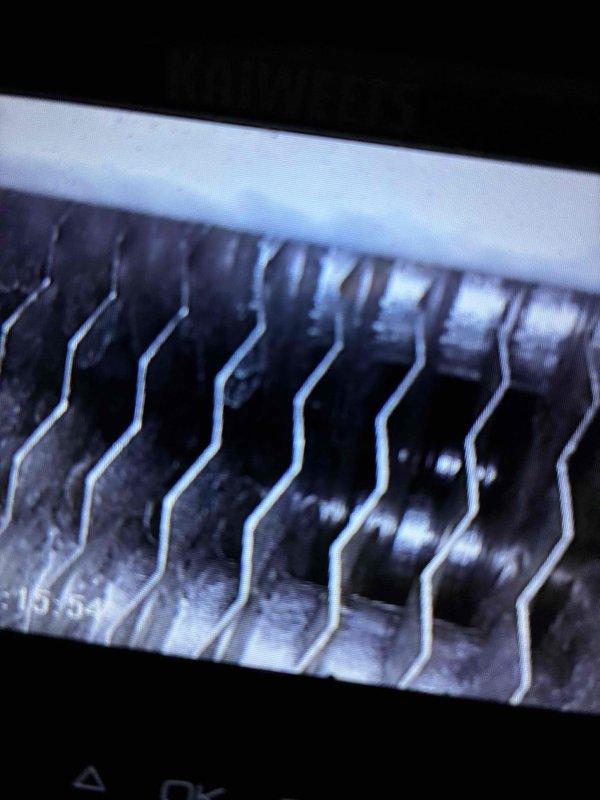 Performed scheduled heating maintenance on a 10+ year old system. Inspected electrical components including fan assembly and wiring connections. Examined heat exchanger fins for proper condition and functionality. All components functioning within normal parameters at completion of service.