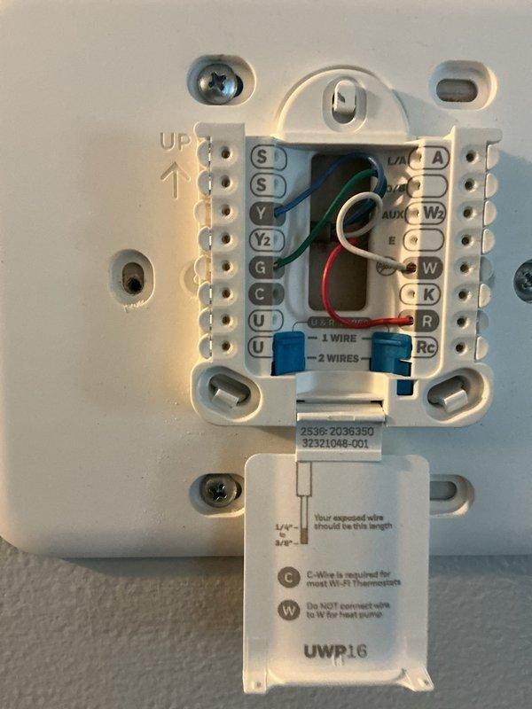 Responded to no-heat call for residential system. Diagnosed issue with thermostat wiring, specifically incorrect terminal connections at the UWP16 mounting plate. Rewired thermostat terminals properly, ensuring correct placement of Y, G, C, W, and R connections. Verified system operation after repair, confirming proper heat cycle and communication between thermostat and furnace.