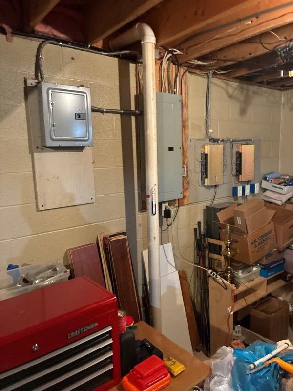 Conducted comprehensive assessment of 30-year-old forced air HVAC system in basement. Inspection revealed aging ductwork with visible metal channels running through exposed ceiling joists. System has reached end of useful life and replacement is recommended based on age and condition of equipment.