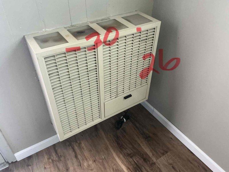 Inspected through-the-wall HVAC unit with a cracked heat exchanger. Documented existing wall-mounted installation and current unit condition with photos. Provided customer with replacement options for through-the-wall configuration to address the safety hazard of the compromised heat exchanger.