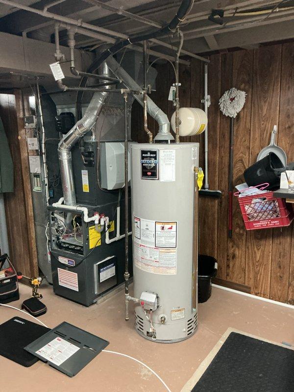 Performed routine heating maintenance service on residential HVAC system. Inspected and serviced furnace unit with connected ductwork and verified proper operation of electronic control module. System is functioning within normal parameters with no issues detected.