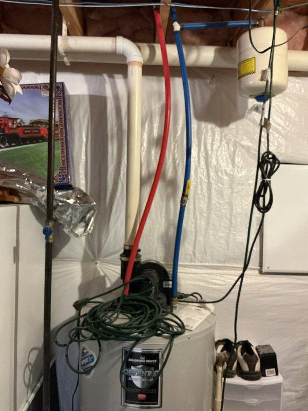 Conducted an on-site evaluation of existing Bradford White Defender water heater installation. Unit shows signs of aging with proper hot/cold water connections and ventilation system. Documented current installation configuration including plumbing connections, electrical components, and surrounding utility area. Prepared estimate for replacement water heater with comparable specifications.