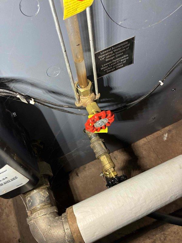 Performed scheduled maintenance on water boiler system. Inspected burner assembly, which showed normal wear but remains in functional condition. Checked all plumbing connections including copper lines, brass fittings, and control valves - all components properly secured and operating within parameters.