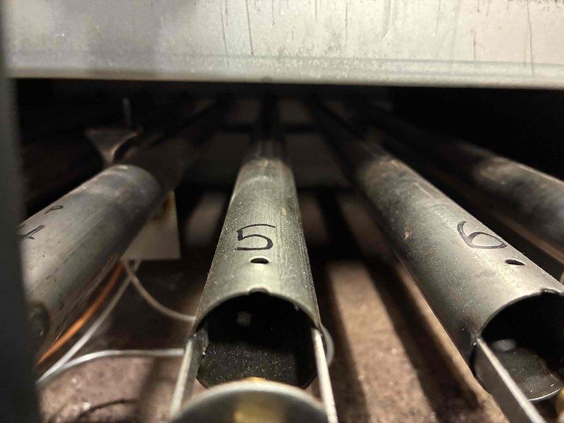 Performed scheduled maintenance on water boiler system. Inspected burner assembly, which showed normal wear but remains in functional condition. Checked all plumbing connections including copper lines, brass fittings, and control valves - all components properly secured and operating within parameters.