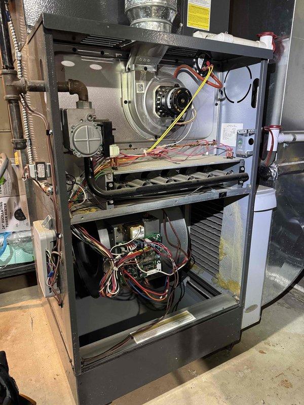 Performed scheduled heating maintenance on furnace system. Conducted thorough inspection of internal components including blower motor, heat exchanger, and control board. Completed combustion analysis with Testo 310 analyzer showing acceptable readings of 2.2% O2 and 694 ppm CO2, confirming proper operation of heating system.