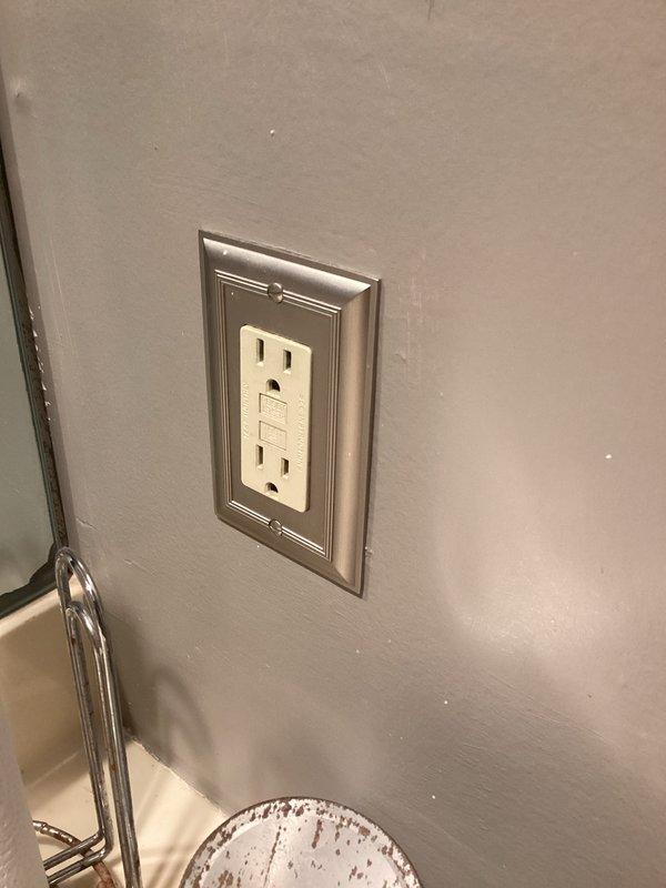 Conducted electrical inspection of premises with focus on GFCI outlet installation and Wi-Fi range extender functionality. Verified proper operation of wall-mounted electronic device showing green indicator light. No electrical hazards identified during inspection; all systems operating within normal parameters.