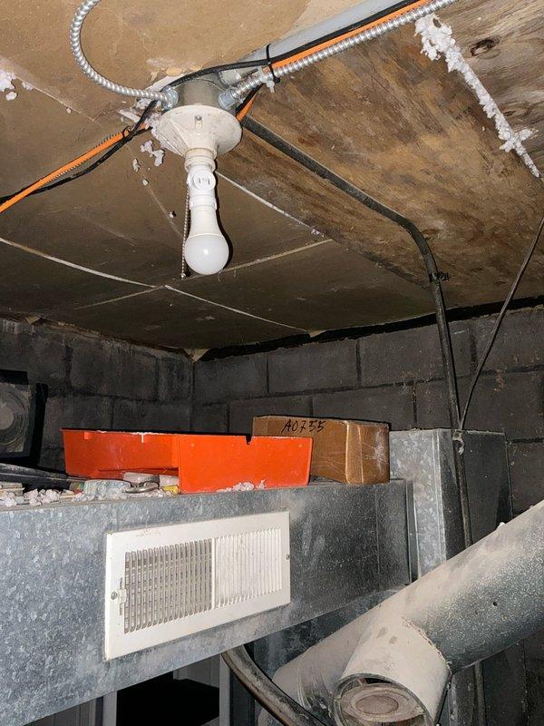 Conducted comprehensive assessment for conversion from existing oil furnace to commercial electric furnace system in retail establishment. Evaluated current electrical infrastructure, including panel capacity and conduit pathways in utility area. Documented exterior electrical service connections for generator installation feasibility while noting the minimal cooling requirements limited to refrigeration units.