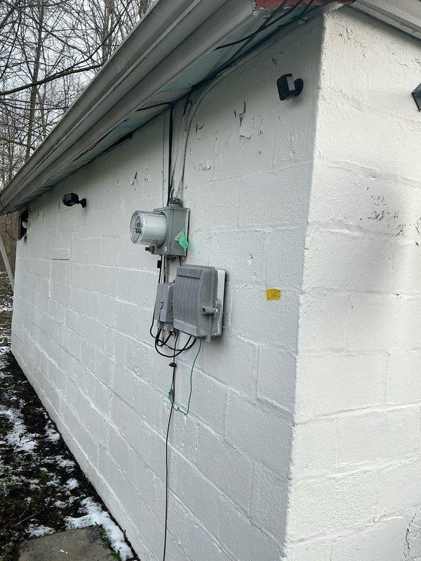 Conducted comprehensive assessment for conversion from existing oil furnace to commercial electric furnace system in retail establishment. Evaluated current electrical infrastructure, including panel capacity and conduit pathways in utility area. Documented exterior electrical service connections for generator installation feasibility while noting the minimal cooling requirements limited to refrigeration units.