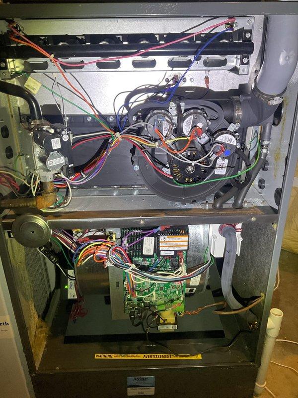 Performed routine HVAC heating maintenance on a P.K. Wadsworth furnace system located in basement utility area. Inspected interior components including blower motor assembly, circuit board, and wiring connections - all found in normal working condition. Customer requested quote for furnace humidifier addition, which will be provided separately.