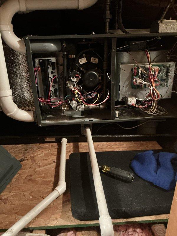 Responded to no-heat call and inspected furnace system. Opened access panel to examine blower motor assembly, circuit board, and electrical components. Visually inspected attic ductwork and insulation to ensure proper installation and airflow.