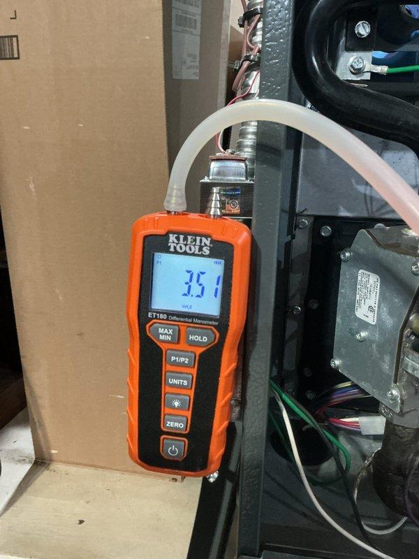 Performed scheduled heating maintenance on Amana furnace system. Conducted differential pressure testing with manometer showing 35.1, verifying proper combustion and ventilation. Inspected all components including ductwork, PVC intake/exhaust venting, and associated equipment; system functioning within normal parameters.